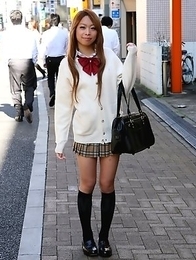 Remika Uehara poses on the street