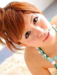 Cute Japanese babe poses outdoor