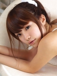 Manami Sato with sexy curves in bath suit plays with pillow