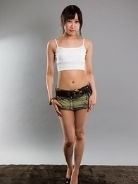 Karina Oshima posing in her sexy skirt before going down on the floor to masturbate