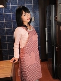 This Asian housewife Nozomi Hazuki poses in