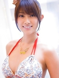 Mikie Hara with big tits and sexy legs listens to the music