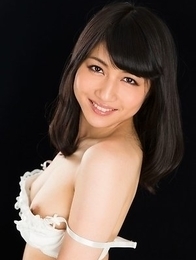 Cheerful teen Reo Saionji posing seductively in her stockings and stylish heels