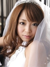 Mirei Oomori takes white wedding lingerie off and shows hot tits.