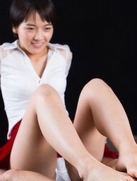 Beauty in red Ai Mukai fingers herself before using her feet to get her slave off