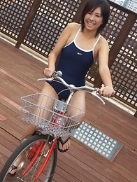 Ageha Yagyu in spandex bath suit shows curves on bike
