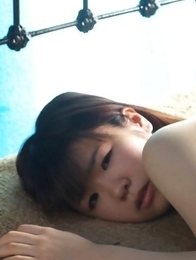 Hikari Azuma plays with bath suit on her generous boobs