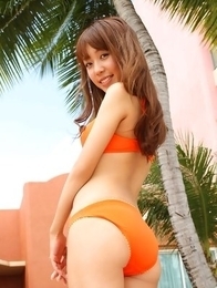 Nozomi Kawasaki is naughty and spreads legs on the beach