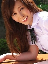 Schoolgirl Iyo Hanak poses at the open air in sexy skirt
